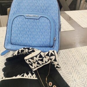 Michael Kors Blue Backpack with Black and White Gloves